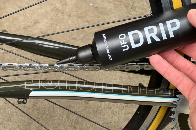 Applying Ceramic Speed UFO Drip chain lube to a bike chain